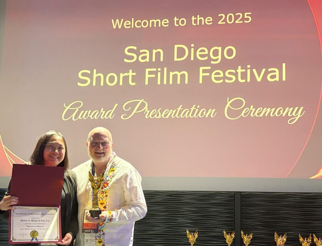 Walt with his producing partner and editor accepting their award in San Diego.